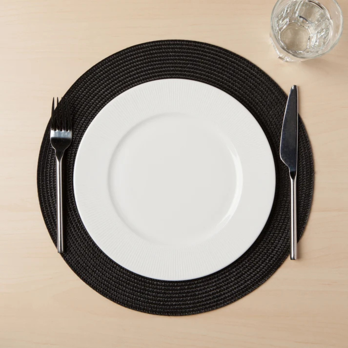 Napperon rond tissé Disko noir 38 cm - Danica