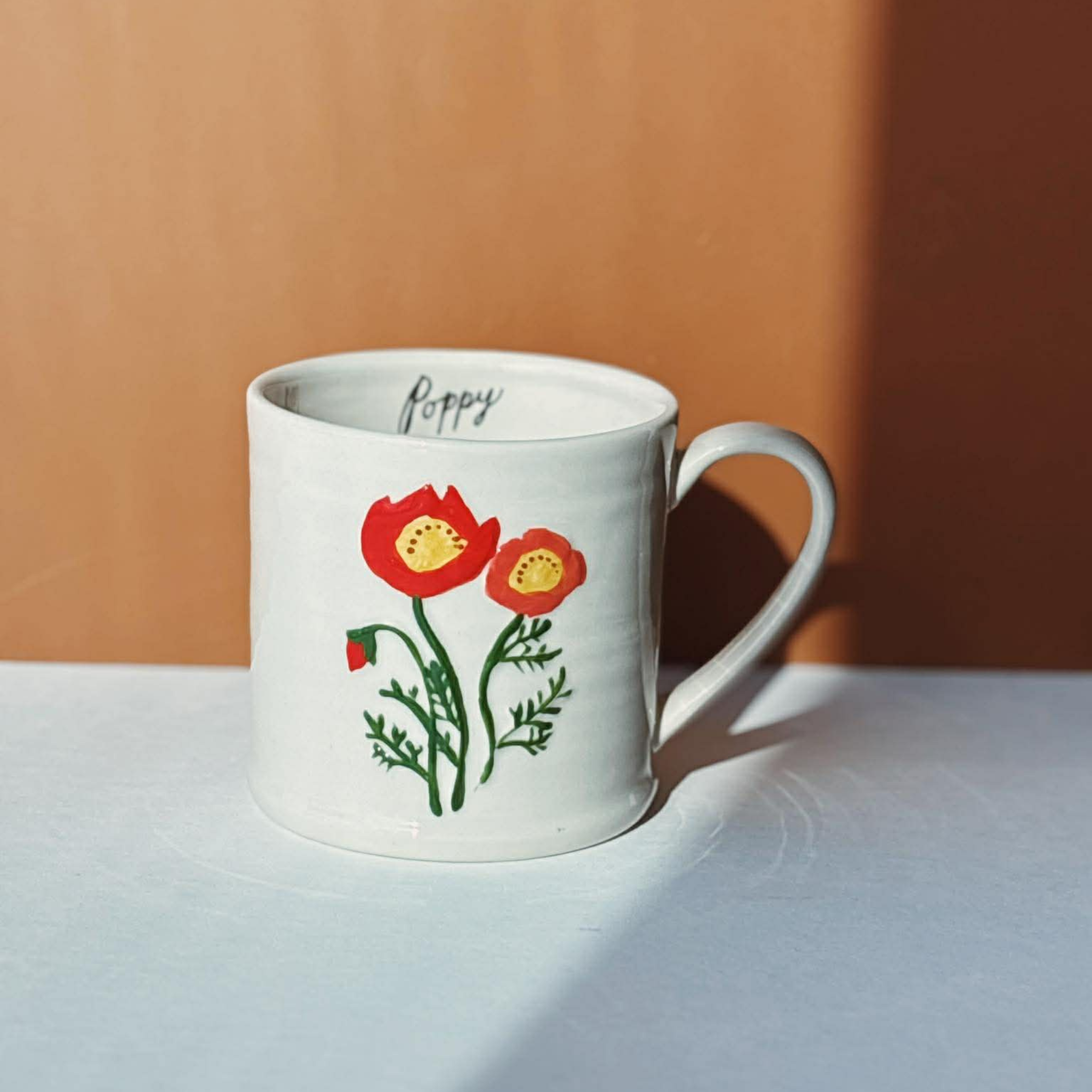 Stoneware mug with embossed poppy, 473 ml - Danica
