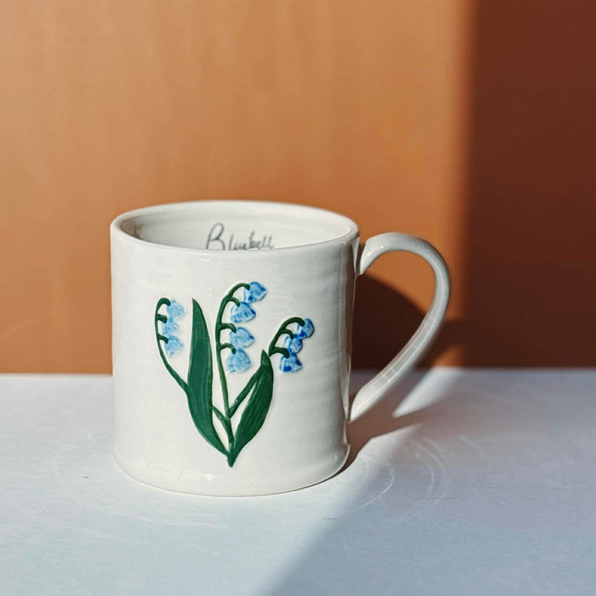 Stoneware mug with embossed bluebell design, 473 ml - Danica